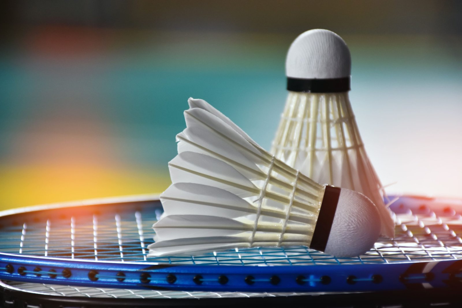 vecteezy-cream-white-badminton-shuttlecock-and-racket-with-neon-light-12130543